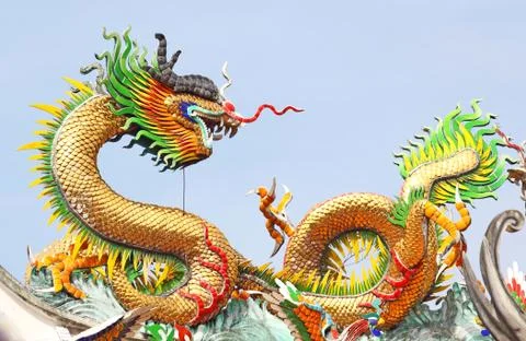 Dragon statue with the blue sky field. Stock Photos