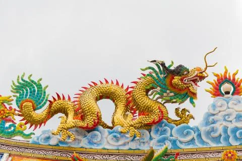 Dragon statue with gray sky background. Stock Photos