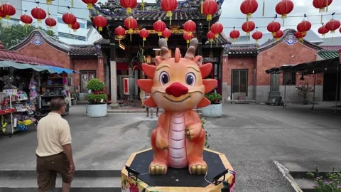 A dragon statue is in the middle of a courtyard Stock Footage 318094982