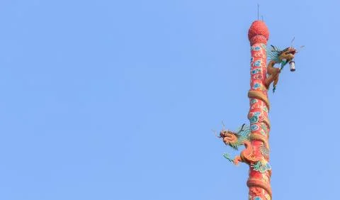 Dragon statue on pole Stock Photos