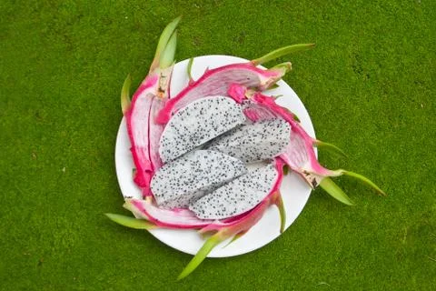 Dragonfruit on green Stock Photos