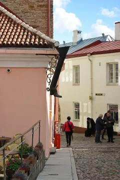Drain in the form of a boot on the old streets of medieval Tallinn Stock Photos