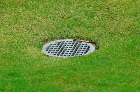 Drain on the golf course Stock Photos