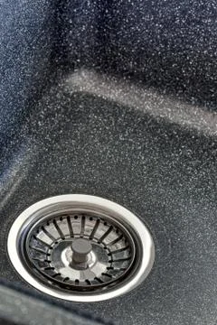 Drain hole in the ceramic sink in the kitchen. Stock Photos