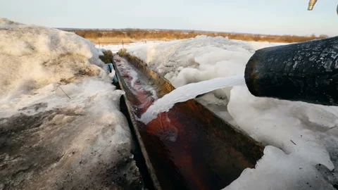Drain outfall in winter. Drinage system outside. Water pipe in process. Stock Footage 118300515