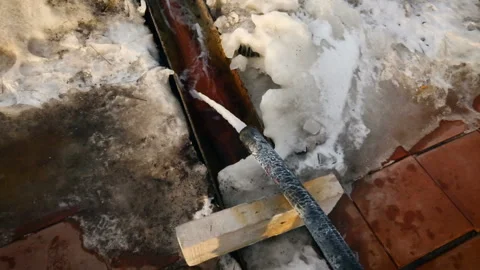 Drain outfall in winter. Drinage system outside. Water pipe in process. Stock Footage 118300588