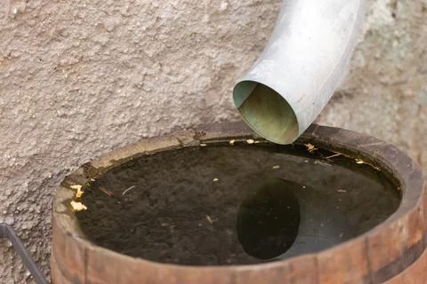 Drain pipe in a barrel Stock Photos