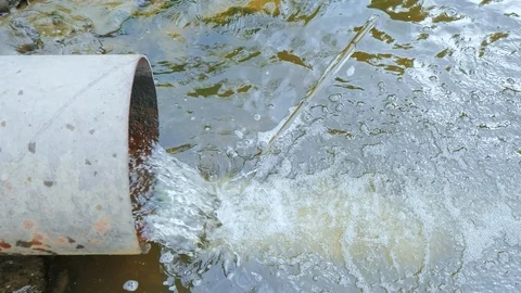 Drain pipe, sewer release wastewater into river, water that has been use Stock Footage 117281571
