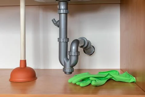 Drain Problems, blockage plumbing kitchen sink pipe unclog plunger drainage Foto stock