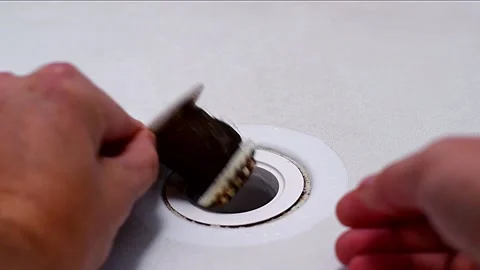 Drain strainer clogged with hair Stock Footage 148285193
