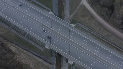 A drainage channel flows under the expressway Stock Footage 114079775