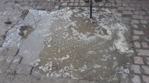 Drainage pipe failure, Flooded sidewalk urban damage Stock Footage 328911450