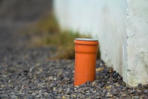 Drainage pipe in the recess of the gutter. Pipe for the water sticking from t Stock-Fotos