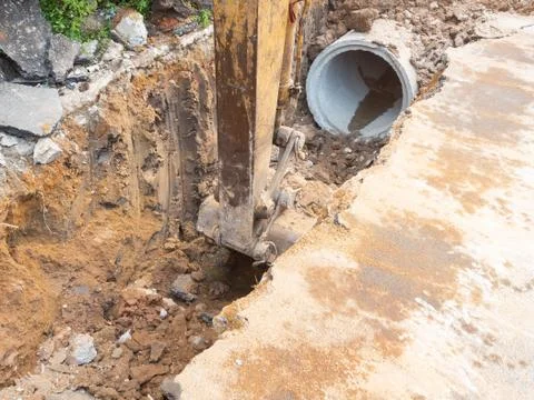 Drainage systems under construction to improve existing roads for increased e Stock Photos