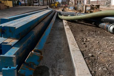 Drainage works on the construction site. Pumping groundwater from dug trenche Stock Photos