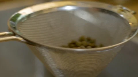 Draining capers C/U Stock Footage 117541648