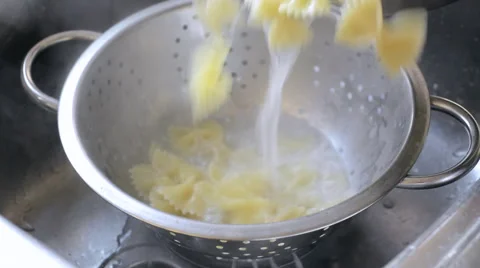 Draining farfalle pasta Stock Footage 47958775