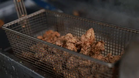 Draining Fried Chicken Legs Stock Footage 254366124