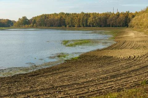 Draining the lake before cleaning. Environmental disaster, pollution of the r Stock Photos