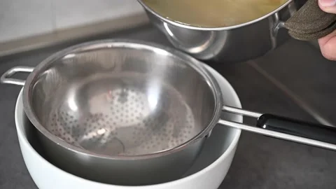 Draining pasta penne, closeup. Stock Footage 154818624