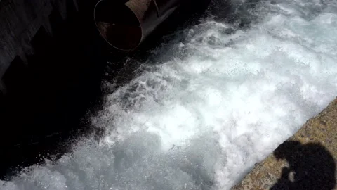 Draining the water pressure into the river. Stock Footage 148465856