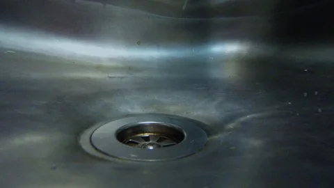 Draining water in sink Stock Footage 97330209