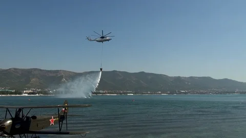 Draining water from VSU-15A spillway device installed on Mi-26T helicopter. Stock Footage 124644133