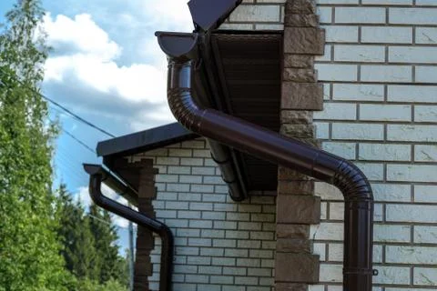 Drainpipe on a house. Stock Photos