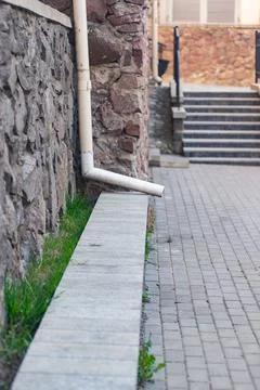 Drainpipe next to the stairs Foto stock