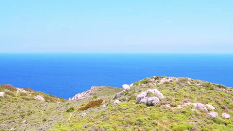 Drakano tower hiking trail path by Ikarian Sea at Ikaria island, Greece Stock Footage 252159643