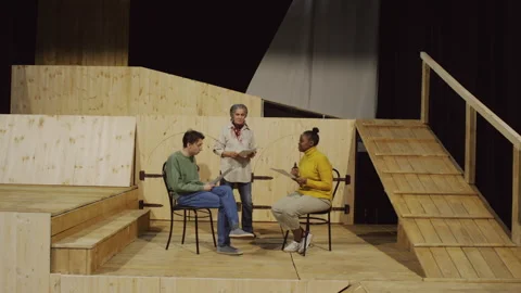 Drama Class Students Practicing Dialogue with Theatre Director Stock Footage 279591180