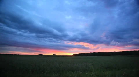 Drama clouds at sunset in the steppe.  NTSC  Timelapse Stock-Footage 25784038