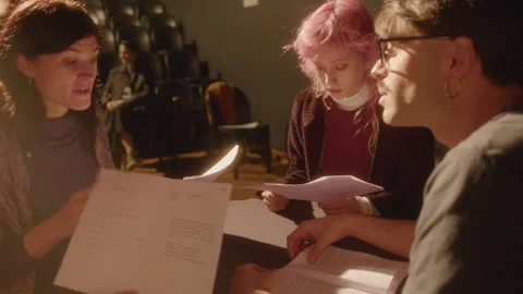 Drama Students Reading Play Scripts on Theater Stage Stock Footage 247783632