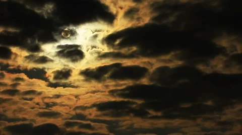  drama sun through  orange  dark clouds in sky. Time lapse in red tones Stock Footage 43796147