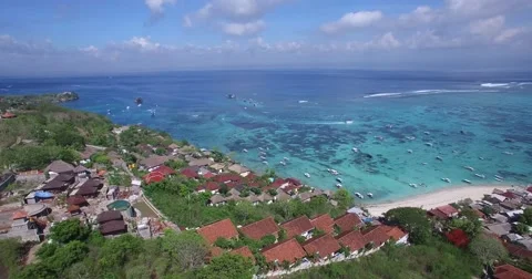 DRAMATIC 4K AERIAL SCENIC CLOSE UP OF BLUE OCEAN, BEACH AND BOATS Stock Footage 60046724