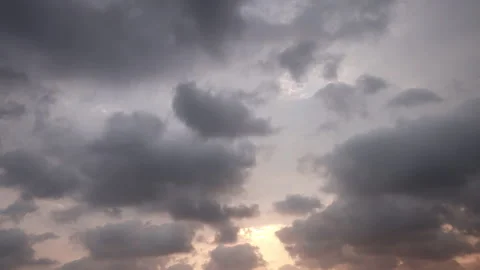 A dramatic 4K time-lapse of dark storm clouds rolling across the sky. Stock Footage 341581438