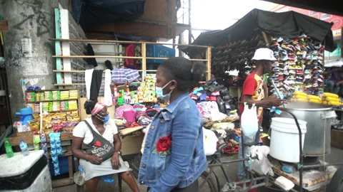 Dramatic 4k video downtown Santo Domingo Haitian market drive buy on gimbal. Stock Footage 141814589