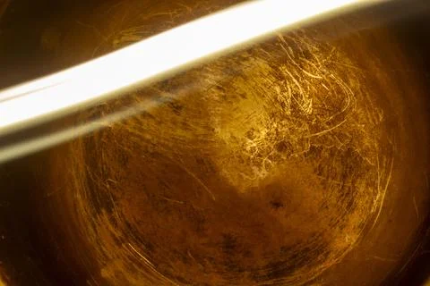 A dramatic abstract composition with a golden swirling texture illuminated 스톡 사진