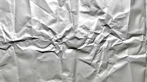 Dramatic abstract texture of intensely crumpled aluminum foil revealing intri Stock Photos