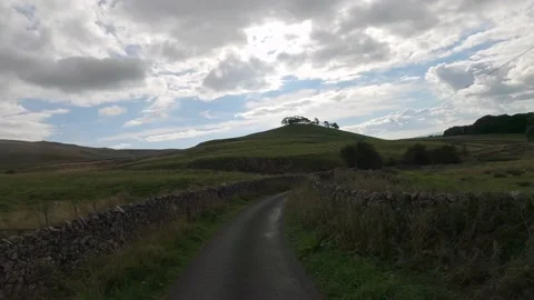 Dramatic action shot along winding Yorkshire Dales Country Lanes Video stock 186143714