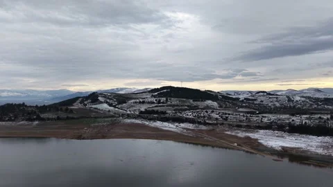 Dramatic aerial 4k drone footage showing snow-covered mountains Stock Footage 341527420