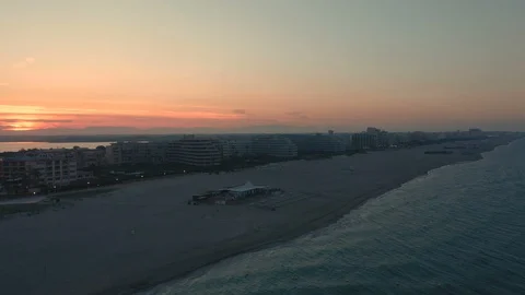 Dramatic aerial camera shot of holiday resort at dusk Stock Footage 112715770