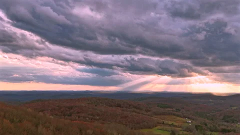 Dramatic aerial cloud hyperlapse with purple clouds 動画素材 332883161