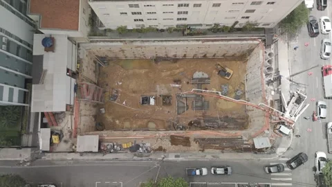 Dramatic Aerial Dolly-Down into Deep Foundation Excavation at Construction Site Stock Footage 321706210