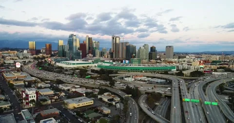 Dramatic Aerial Downtown Los Angeles Skyline Pull Back Moody Cloudy Sunset Dusk Stock Footage 147307331