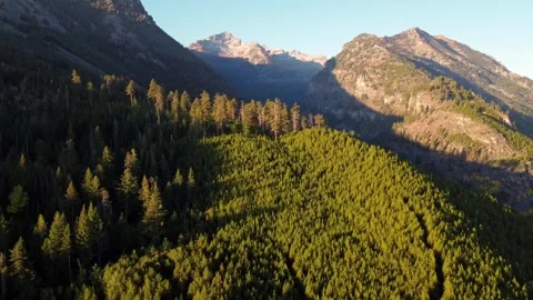 Dramatic Aerial Morning Flight into Rugged High Country Valley Video stock 240748448