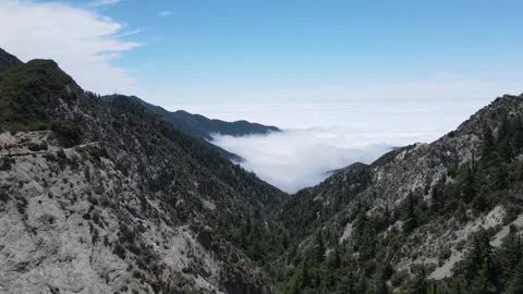 Dramatic Aerial of Mount Wilson – Clouds Meet Peaks Stock Footage 297543207