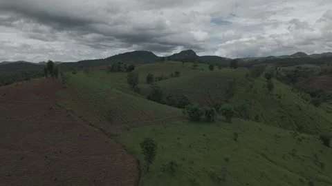 Dramatic Aerial Panorama of Dark Green Hills, Earthy Slopes and Stormy Mons.. Stock Footage 337392296