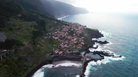Dramatic aerial perspective of the charming coastal village of seixal in Stock Footage 321937197