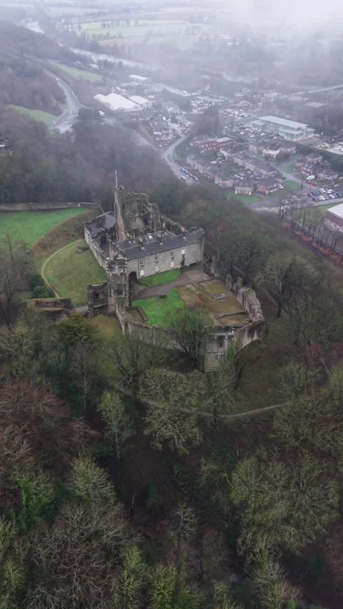 Dramatic aerial perspective circling Prudhoe Castle amidst passing fog Stock Footage 336278207